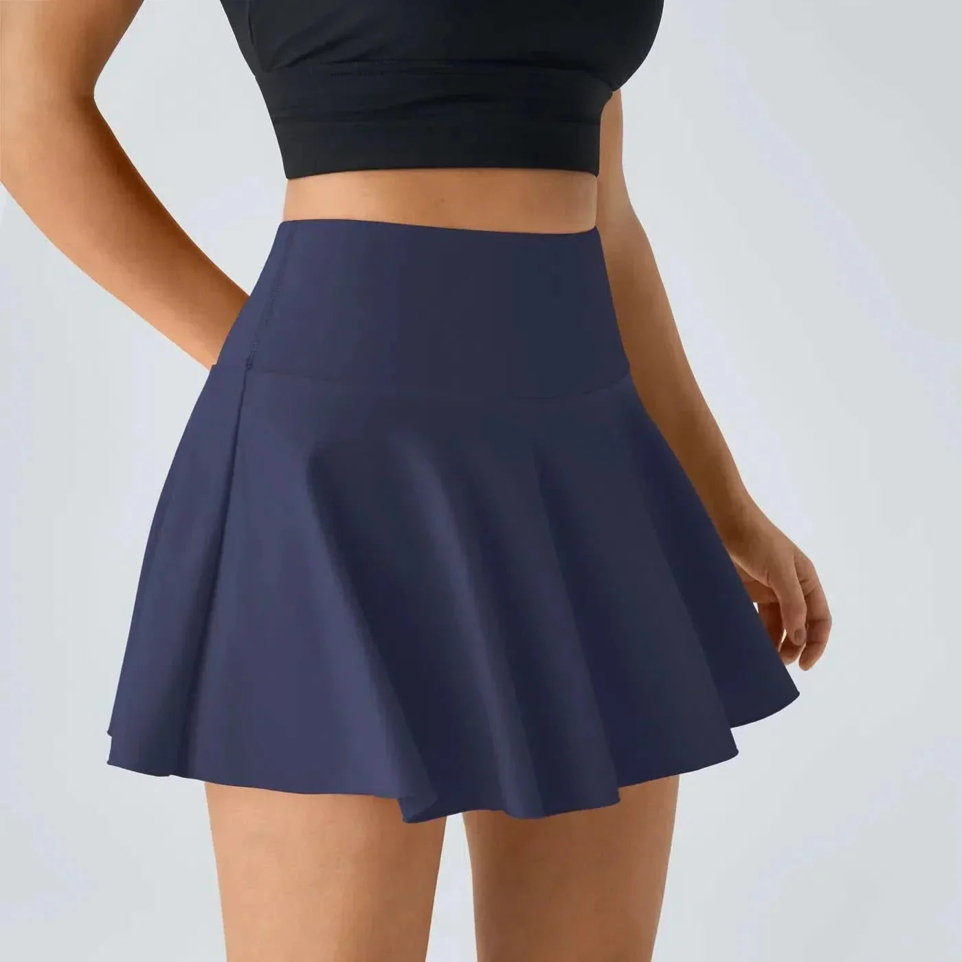 AeroLuxe 2v1 vzdušná tenisová sukně s integrovanými šortkami a ochranou UPF50 Plus