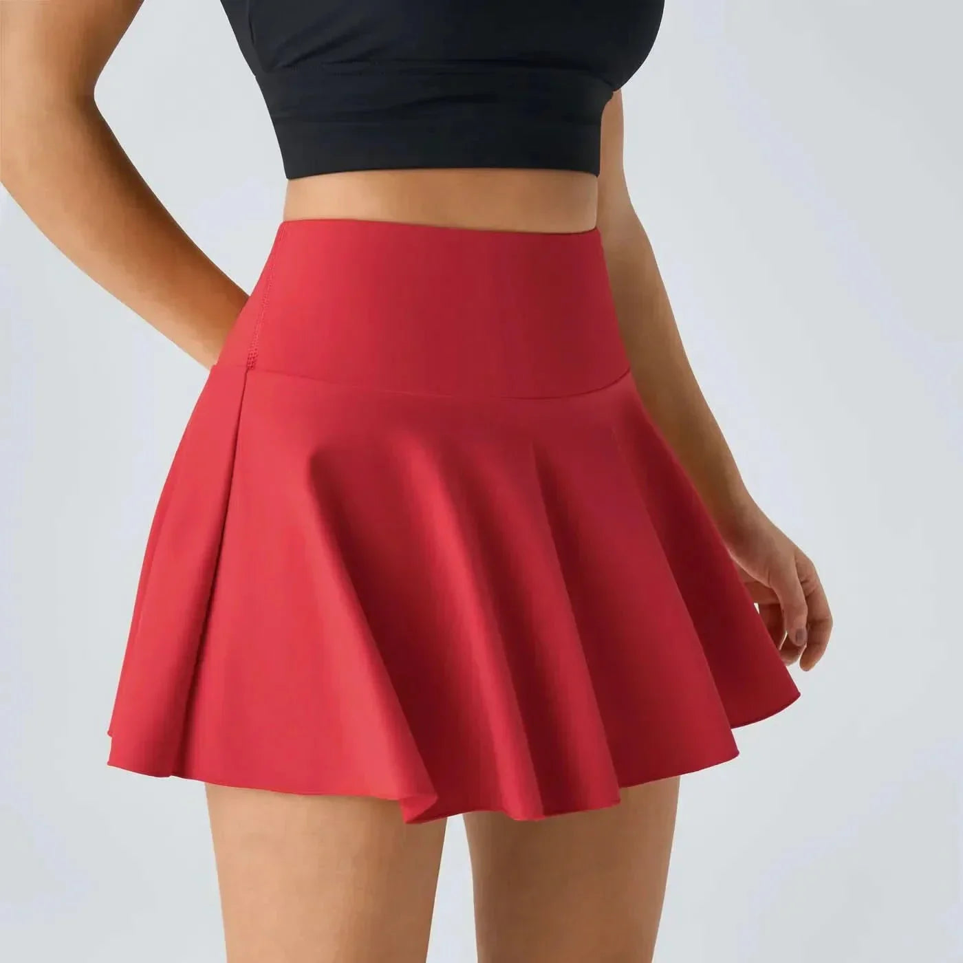 AeroLuxe 2v1 vzdušná tenisová sukně s integrovanými šortkami a ochranou UPF50 Plus