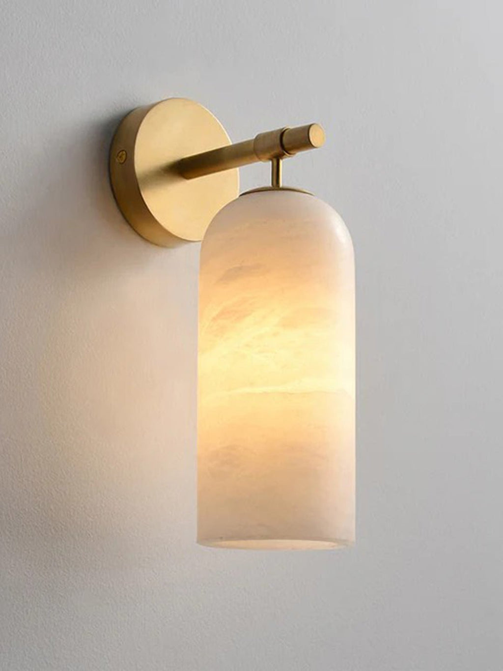 Lampada da parete cilindrica in alabastro con luce calda e cornice dorata