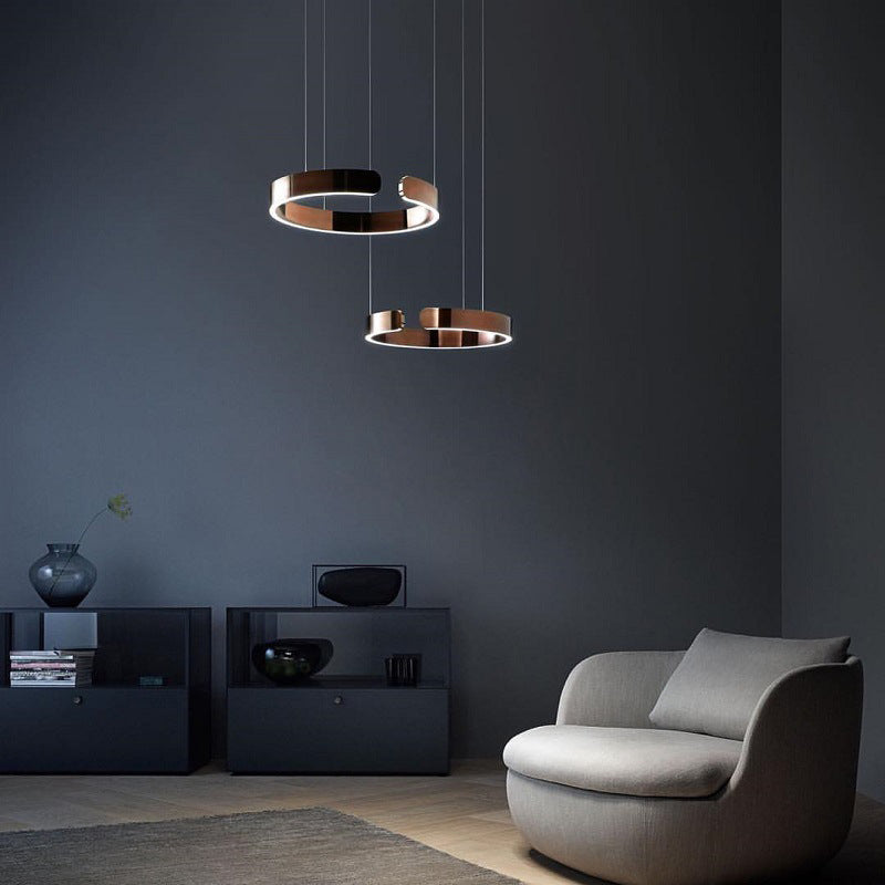 Lampa wisząca Lumera z podwójnym pierścieniem i ciepłym, brązowym blaskiem do nowoczesnych wnętrz