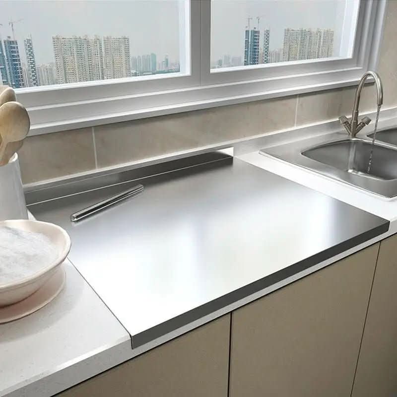 Durable stainless steel food prep board with integrated edge and non-slip feet