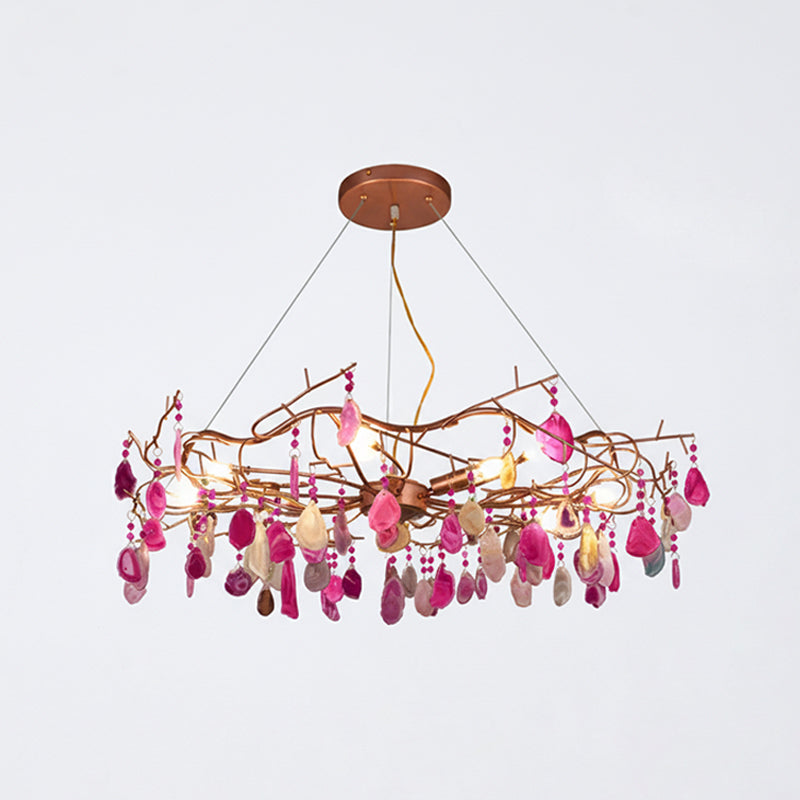 Lampadario a goccia con pietra naturale e struttura in oro rosa, illuminazione classica per villa