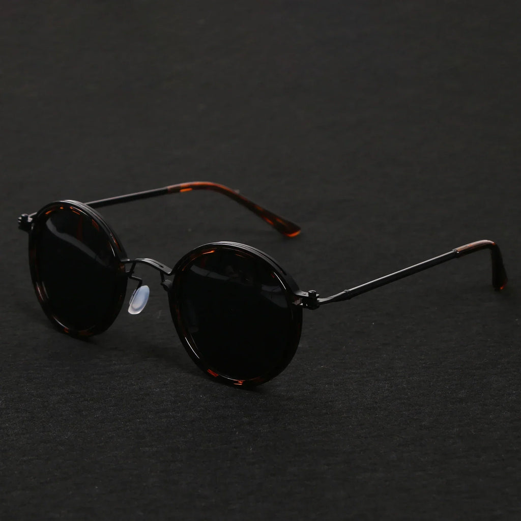 Gafas de sol redondas retro Ricco Milano con estilo atemporal