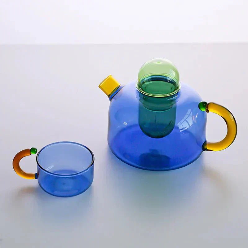 Translucent Glass Kettle And Mug Set With Bold Color Contrast
