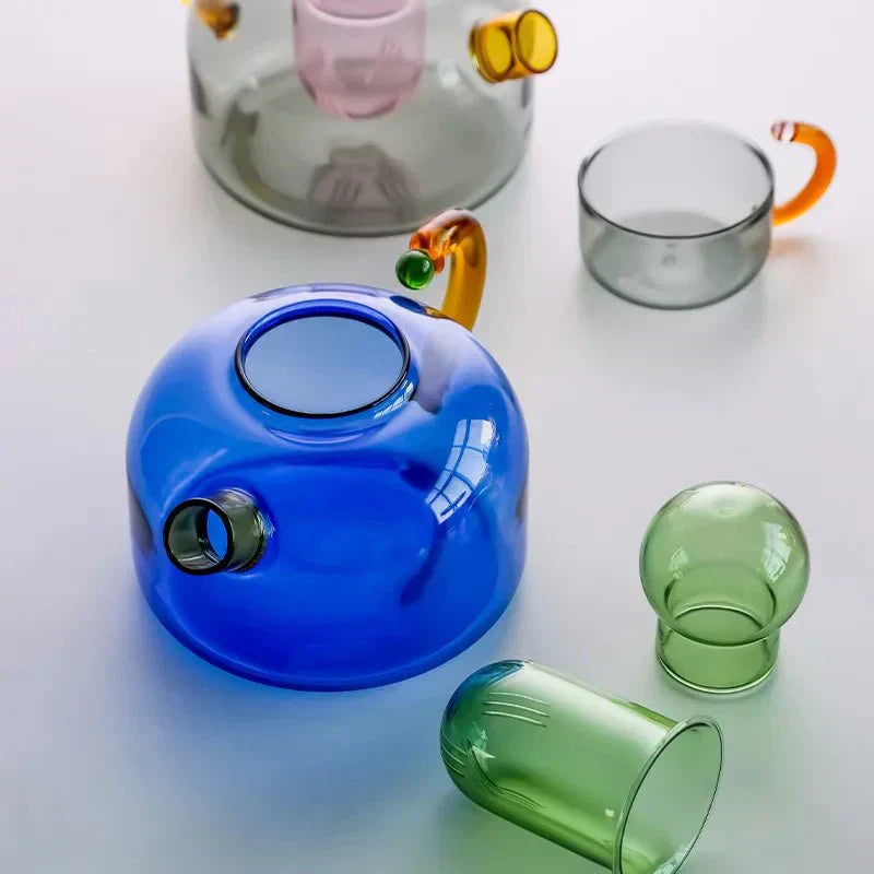 Translucent Glass Kettle And Mug Set With Bold Color Contrast