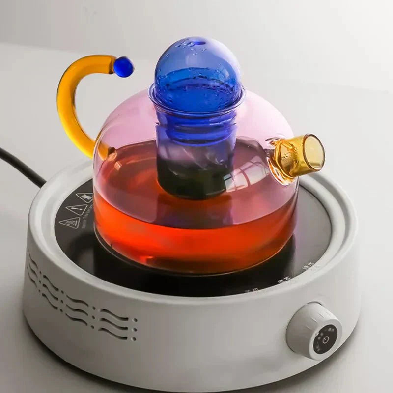 Translucent Glass Kettle And Mug Set With Bold Color Contrast