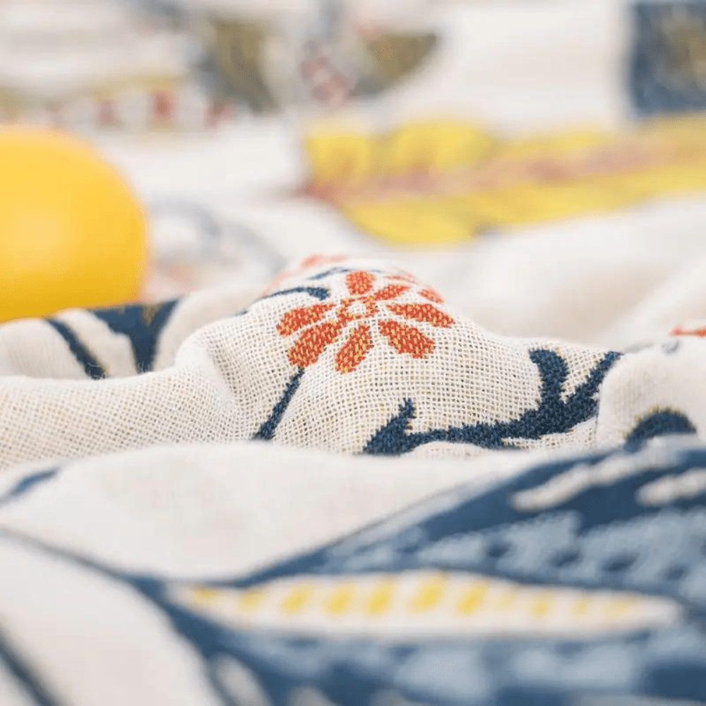Coperta MEADOWNEST in cotone rustico con motivo floreale e design reversibile