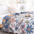 Coperta MEADOWNEST in cotone rustico con motivo floreale e design reversibile